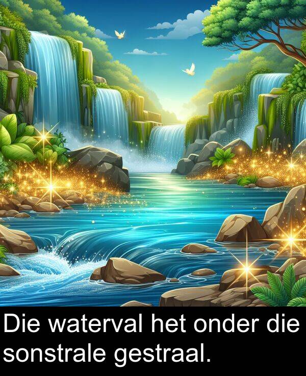 onder: Die waterval het onder die sonstrale gestraal.