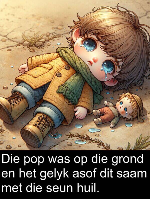 huil: Die pop was op die grond en het gelyk asof dit saam met die seun huil.