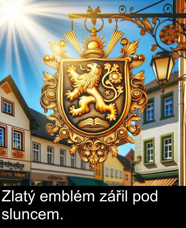 pod: Zlatý emblém zářil pod sluncem.