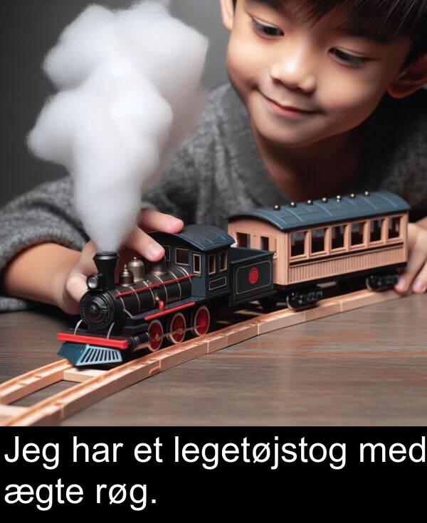 med: Jeg har et legetøjstog med ægte røg.