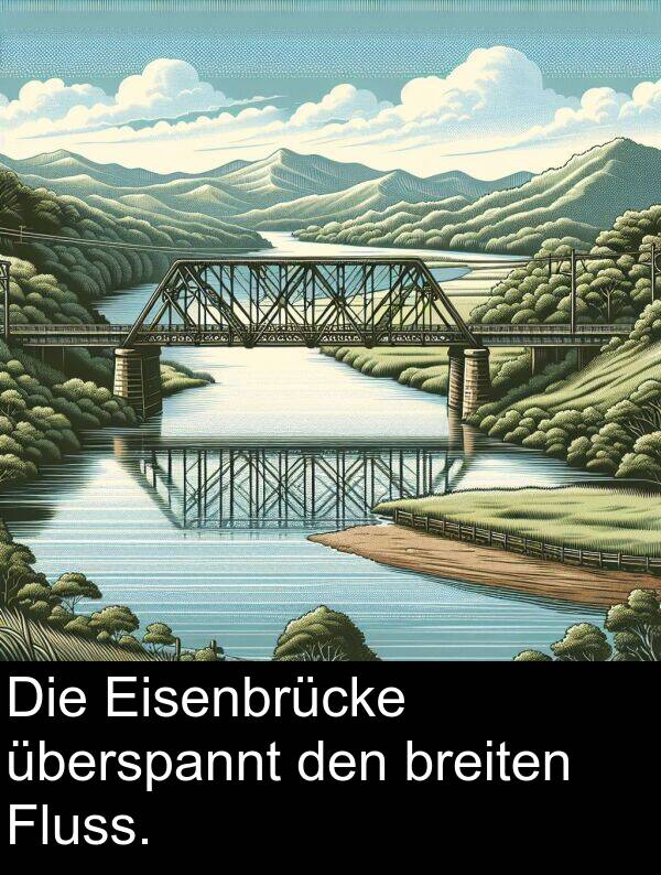 Fluss: Die Eisenbrücke überspannt den breiten Fluss.