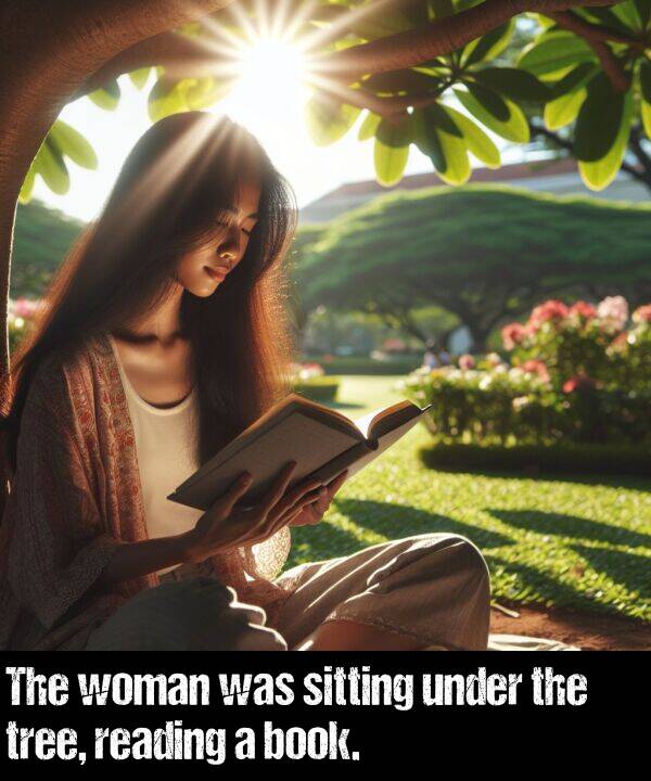 woman: The woman was sitting under the tree, reading a book.