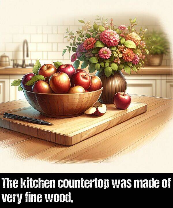 wood: The kitchen countertop was made of very fine wood.