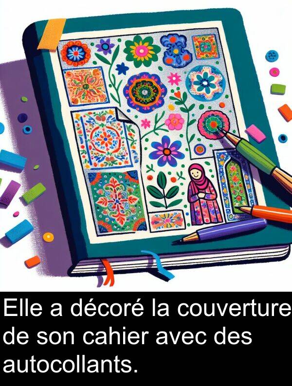 cahier: Elle a décoré la couverture de son cahier avec des autocollants.