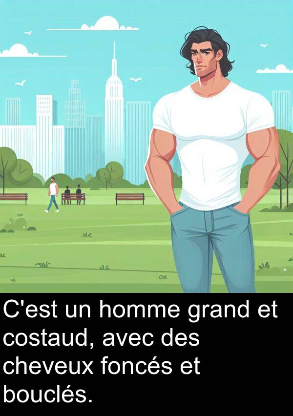 grand: C'est un homme grand et costaud, avec des cheveux foncés et bouclés.