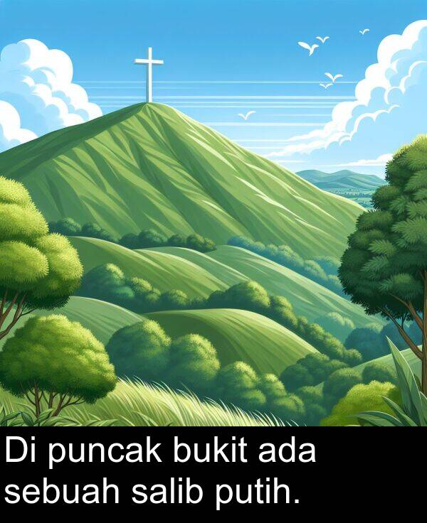 sebuah: Di puncak bukit ada sebuah salib putih.