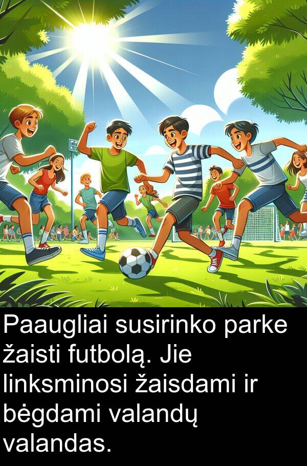 žaisdami: Paaugliai susirinko parke žaisti futbolą. Jie linksminosi žaisdami ir bėgdami valandų valandas.