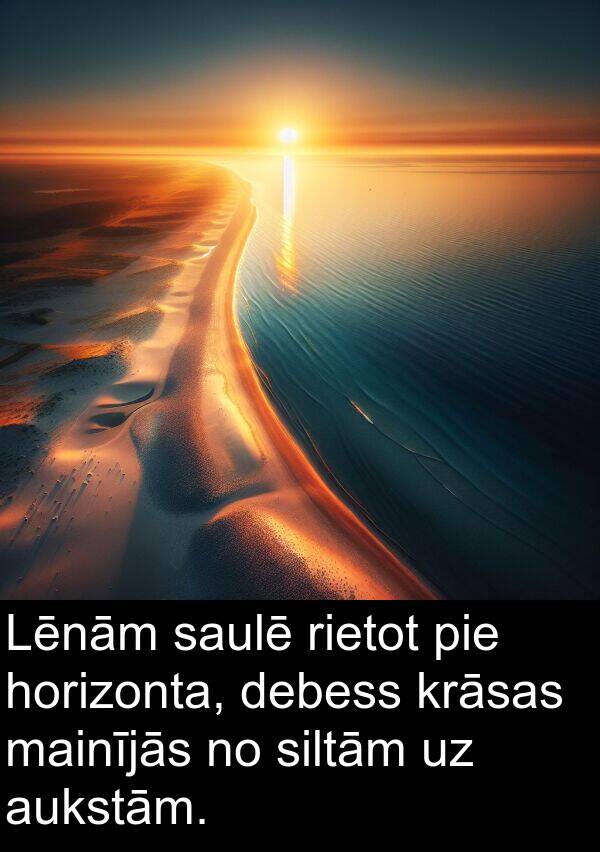 horizonta: Lēnām saulē rietot pie horizonta, debess krāsas mainījās no siltām uz aukstām.