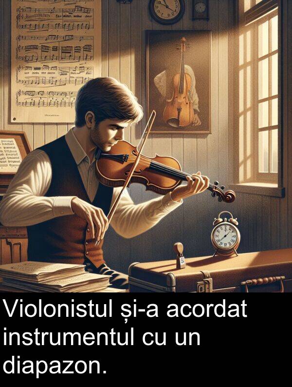 instrumentul: Violonistul și-a acordat instrumentul cu un diapazon.