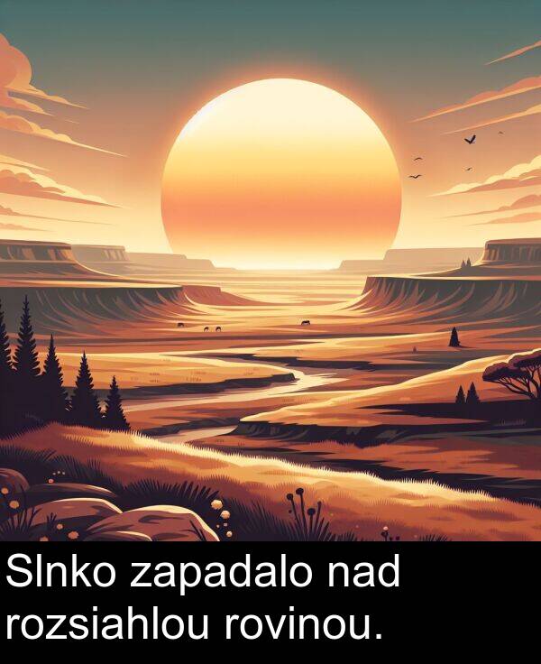 nad: Slnko zapadalo nad rozsiahlou rovinou.