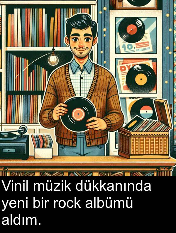 rock: Vinil müzik dükkanında yeni bir rock albümü aldım.