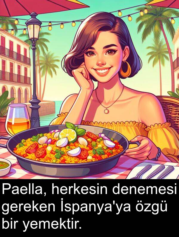 denemesi: Paella, herkesin denemesi gereken İspanya'ya özgü bir yemektir.