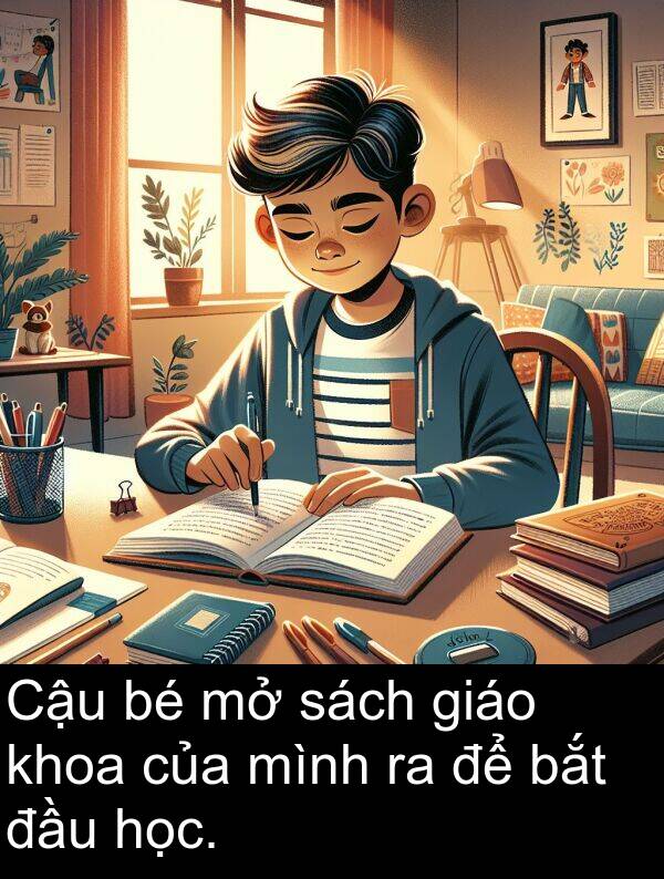 sách: Cậu bé mở sách giáo khoa của mình ra để bắt đầu học.